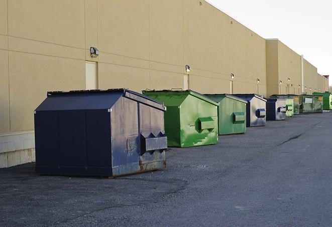 construction dumpsters on a worksite surrounded by caution tape in Clearfield UT